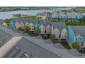 Aerial view of colorful townhomes, offering picturesque waterfront views and convenient parking at 81 Sandbar Ln # 23, Folly Beach, SC 29439