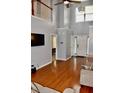 Inviting home foyer with gleaming hardwood floors, a high ceiling and access to the second story at 9122 Maple Grove Dr, Summerville, SC 29485
