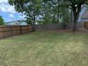 Large, fenced-in backyard offering privacy and ample space for recreation and outdoor enjoyment at 101 Limerick Cir, Summerville, SC 29483