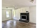Bright living room with sleek fireplace, ceiling fan, and fresh paint at 101 Limerick Cir, Summerville, SC 29483