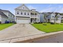 Inviting two-story home with a spacious driveway and lush green lawn at 1017 Saltwater Cir, Johns Island, SC 29455