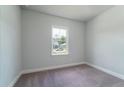 Cozy bedroom with neutral carpet, white trim, and plenty of natural light at 122 Royal Cainhoy Way, Huger, SC 29450