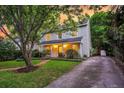 Inviting two-story home with a well-maintained lawn, long driveway, and classic curb appeal at 1433 Oaklanding Rd, Mount Pleasant, SC 29464