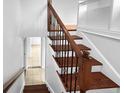 Elegant staircase with decorative wrought iron railing and beautiful wood treads at 1481 Woodview Ln, Charleston, SC 29412