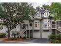 Charming townhome featuring double front porches, white trim, and garage parking at 1532 Sea Palms Cres, Mount Pleasant, SC 29464