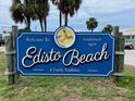 A Welcome To Edisto Beach sign reads 'A Gathering Tradition' established in 1970 at 1604 Jungle Rd, Edisto Island, SC 29438