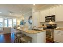 Modern kitchen featuring stainless steel appliances, granite countertops, and ample cabinet space at 204 Michigan Ave # C-5 - 11, Folly Beach, SC 29439