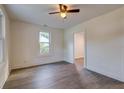 Bright bedroom with light walls, laminate flooring, and a classic ceiling fan at 2657 Oregon Ave, North Charleston, SC 29405