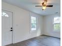 Well-lit bedroom with laminate floors, light walls, and white trim at 2657 Oregon Ave, North Charleston, SC 29405