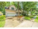 Charming home featuring a lovely front porch, well-maintained lawn, and an attached garage at 3005 Macbeth Creek Dr, Charleston, SC 29414