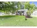 Well maintained home with a large, green lawn and beautiful landscaping creates excellent curb appeal at 414 Birch Ave, Goose Creek, SC 29445