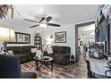 Cozy living room with beautiful wood-look floors, ceiling fan, and comfortable furniture, perfect for relaxing at 414 Birch Ave, Goose Creek, SC 29445