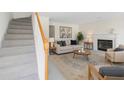 Inviting living room featuring a cozy fireplace, neutral tones, and comfortable seating at 4850 Habersham Ln, Summerville, SC 29485