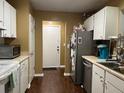 Traditional-style kitchen features white cabinets and stainless steel appliances at 806 Greenmeadow Dr, Goose Creek, SC 29445