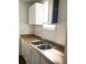 Kitchen showing stainless steel sink, faucet, and cabinets at 8930 Selah St, North Charleston, SC 29406