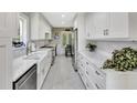 Stylish kitchen featuring sleek white cabinetry, marble countertops and stainless appliances at 1199 Parkway Drive, Mount Pleasant, SC 29464