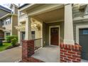 Inviting front porch with brick accents, a pergola, and a view of the front yard at 1253 Dingle Rd, Mount Pleasant, SC 29466