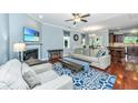 Cozy living room featuring a fireplace, comfortable seating, and views into the dining area at 1253 Dingle Rd, Mount Pleasant, SC 29466