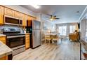 Cozy interior with modern kitchen, an eat in dining area and comfortable furniture in the inviting living room at 1400 Ocean Blvd # 106B, Isle of Palms, SC 29451