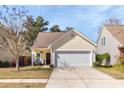 Inviting single-Gathering home with a two-car garage, manicured lawn, and welcoming facade at 1516 Oldenburg Dr, Mount Pleasant, SC 29466