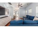 Bright living room with hardwood floors, blue sofa, and plenty of natural light at 1516 Oldenburg Dr, Mount Pleasant, SC 29466