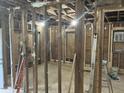 Spacious interior framing with exposed beams, ready for renovation at 1912 English St, North Charleston, SC 29405