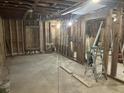 Spacious interior framing with exposed beams, ready for renovation at 1912 English St, North Charleston, SC 29405