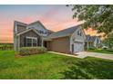 Stylish home boasts mixed siding and stone accents with a manicured lawn and convenient two-car garage at 199 Decatur Dr, Summerville, SC 29486