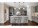 Well-appointed kitchen boasts stainless steel appliances, a center island, and pendant lighting at 2234 Kemmerlin St, Johns Island, SC 29455
