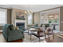 Bright living room featuring a fireplace, hardwood floors, and modern furnishings at 2234 Kemmerlin St, Johns Island, SC 29455