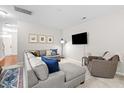Comfortable living room with a large sectional sofa, neutral walls, and a cozy armchair at 2505 Stadium Dr, North Charleston, SC 29406