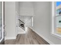 Spacious entryway with hardwood floors, leading to a staircase and living area at 2807 Grange Cir, Summerville, SC 29486
