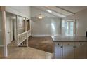 Bright living room featuring vaulted ceilings with a skylight, neutral walls, and ample natural light at 2827 Haverhill Cir, North Charleston, SC 29420