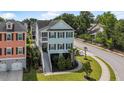 Charming raised beach home featuring a two-story design and inviting staircase at 307 Morning Marsh Ln, Charleston, SC 29492