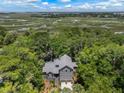 Breathtaking aerial view of a beautiful home surrounded by lush greenery and waterways at 3125 Privateer Creek Rd, Seabrook Island, SC 29455