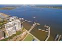 Gorgeous aerial view of the harbor, bridge, and waterfront community with private docks at 330 Concord St # 12C, Charleston, SC 29401