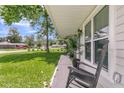Inviting front porch with rocking chairs and lush landscaping, creating a cozy and welcoming entrance at 402 Woodward Blvd, Summerville, SC 29483