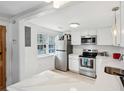 Bright kitchen with white cabinets, stainless steel appliances, and a stylish countertop at 9 F St, Charleston, SC 29403