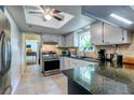 Bright kitchen with stainless steel appliances, granite countertops, and ample cabinet space at 102 Cottonwood Dr, Summerville, SC 29483