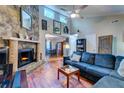 Living room featuring vaulted ceiling, fireplace, and seamless flow to dining area at 102 Cottonwood Dr, Summerville, SC 29483