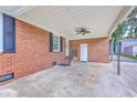 Spacious carport with a ceiling fan offering sheltered parking and access to the home at 108 Reardon St, Moncks Corner, SC 29461