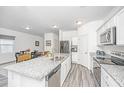 Modern kitchen featuring granite countertops, stainless steel appliances, and a large island at 109 Lyra Ln, Summerville, SC 29486