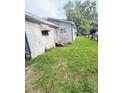 Exterior shot of the home revealing the backyard and awning covered entrance at 1124 Davidson Ave, Charleston, SC 29407