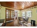 Inviting dining room featuring a decorative wood ceiling and classic wooden cabinet at 145 Ravenell Dr, Saint Stephen, SC 29479