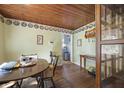 Cozy dining area with wood accents, decorative plates, and an adjacent doorway at 145 Ravenell Dr, Saint Stephen, SC 29479