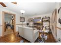 Comfortable living room space with wood-look flooring and an open doorway at 145 Ravenell Dr, Saint Stephen, SC 29479