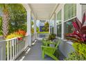 Cozy porch with seating and vibrant plants, creating a relaxing outdoor space at 1530 Willtown St, Daniel Island, SC 29492