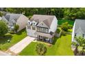 Beautiful two-story home with a landscaped yard and a charming front porch at 158 Balsam Cir, Summerville, SC 29485