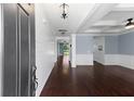 Inviting entryway featuring hardwood floors, wainscoting, and a view into the living area at 158 Netherfield Dr, Summerville, SC 29486