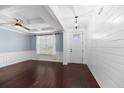 Open-concept living area with hardwood floors, wainscoting, coffered ceilings, and natural light at 158 Netherfield Dr, Summerville, SC 29486